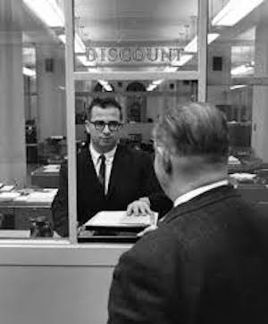 In its early days, the discount window was a physical window located within each regional Federal Reserve Bank, as shown in this 1960s photo of the window inside the New York Fed